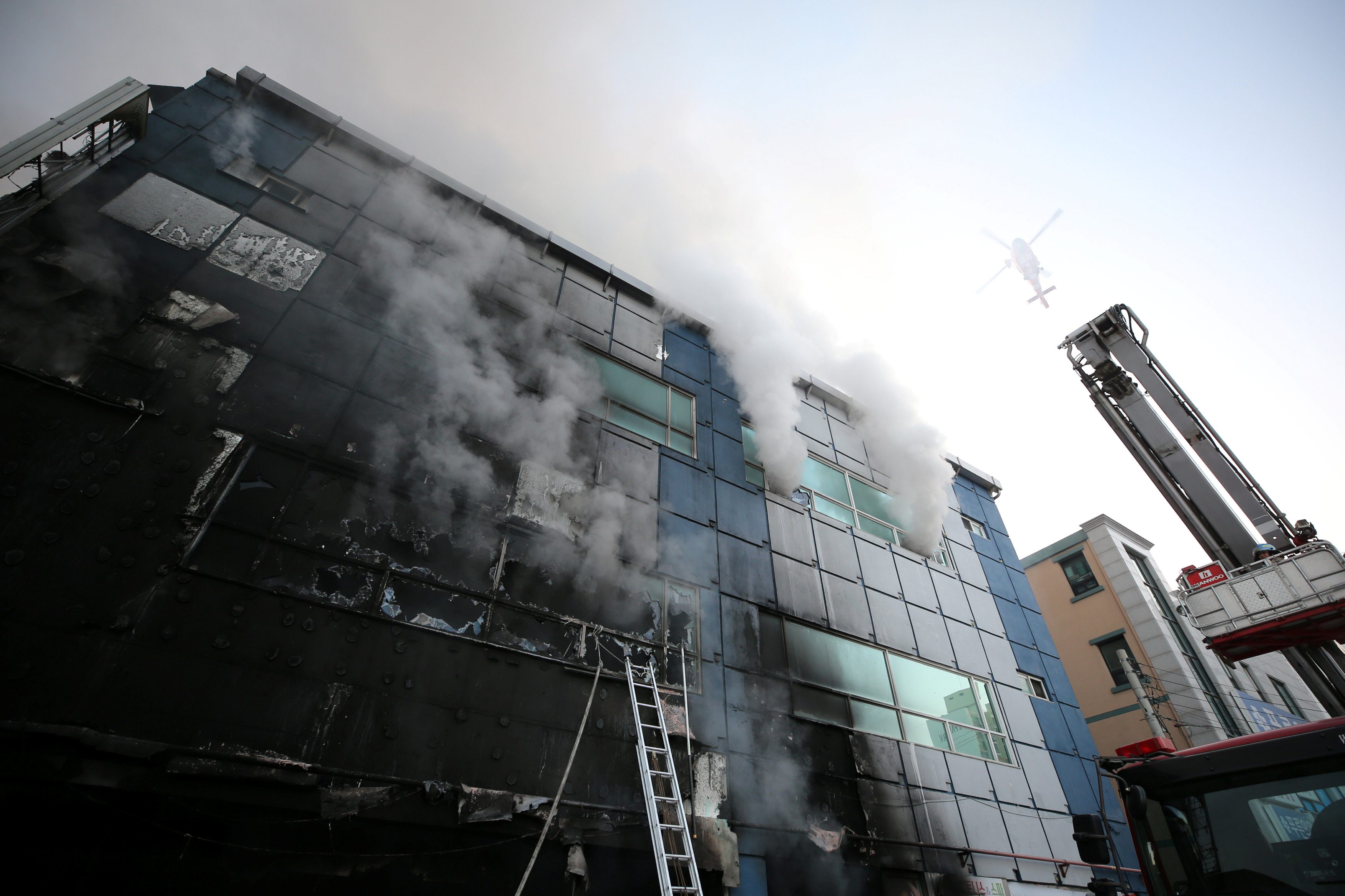 Smoke rises from a burning building in Jecheon, South Korea, December 21, 2017. Yonhap via REUTERS ATTENTION EDITORS - THIS IMAGE HAS BEEN SUPPLIED BY A THIRD PARTY. SOUTH KOREA OUT. NO RESALES. NO ARCHIVE.